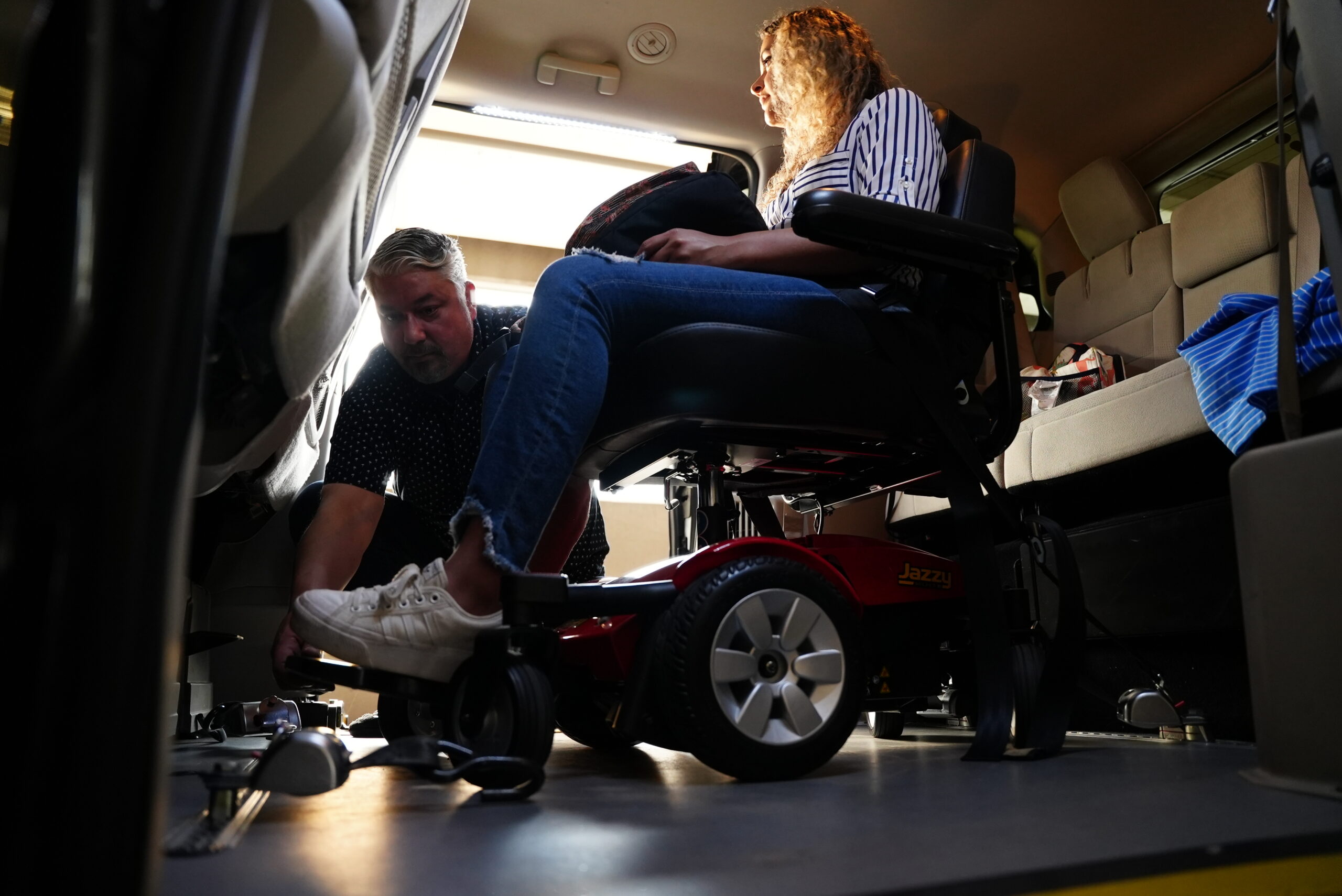 Photo of woman learning to use the wheelchair accessible van features