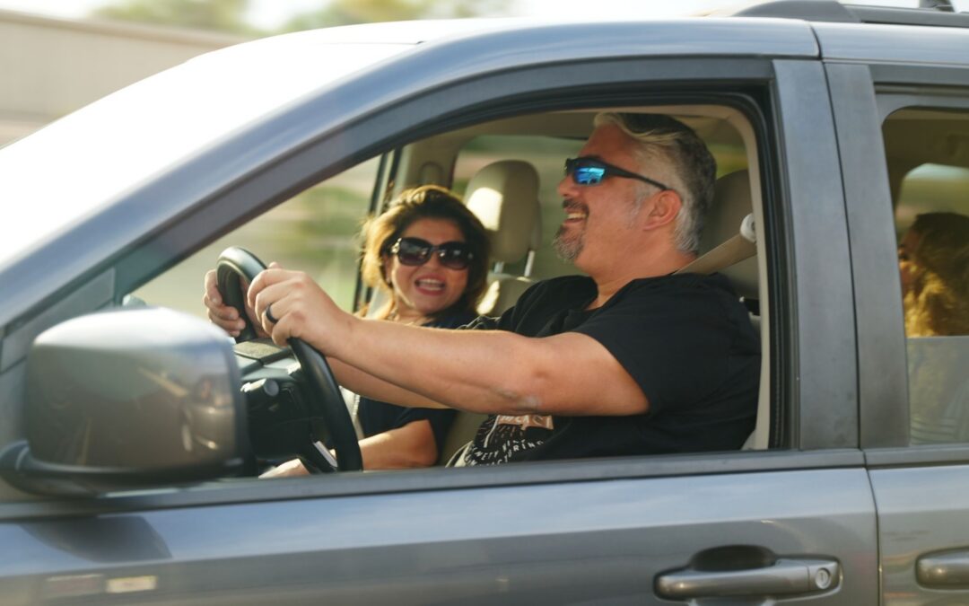 Couple enjoying summer travel in an accessible vehicle