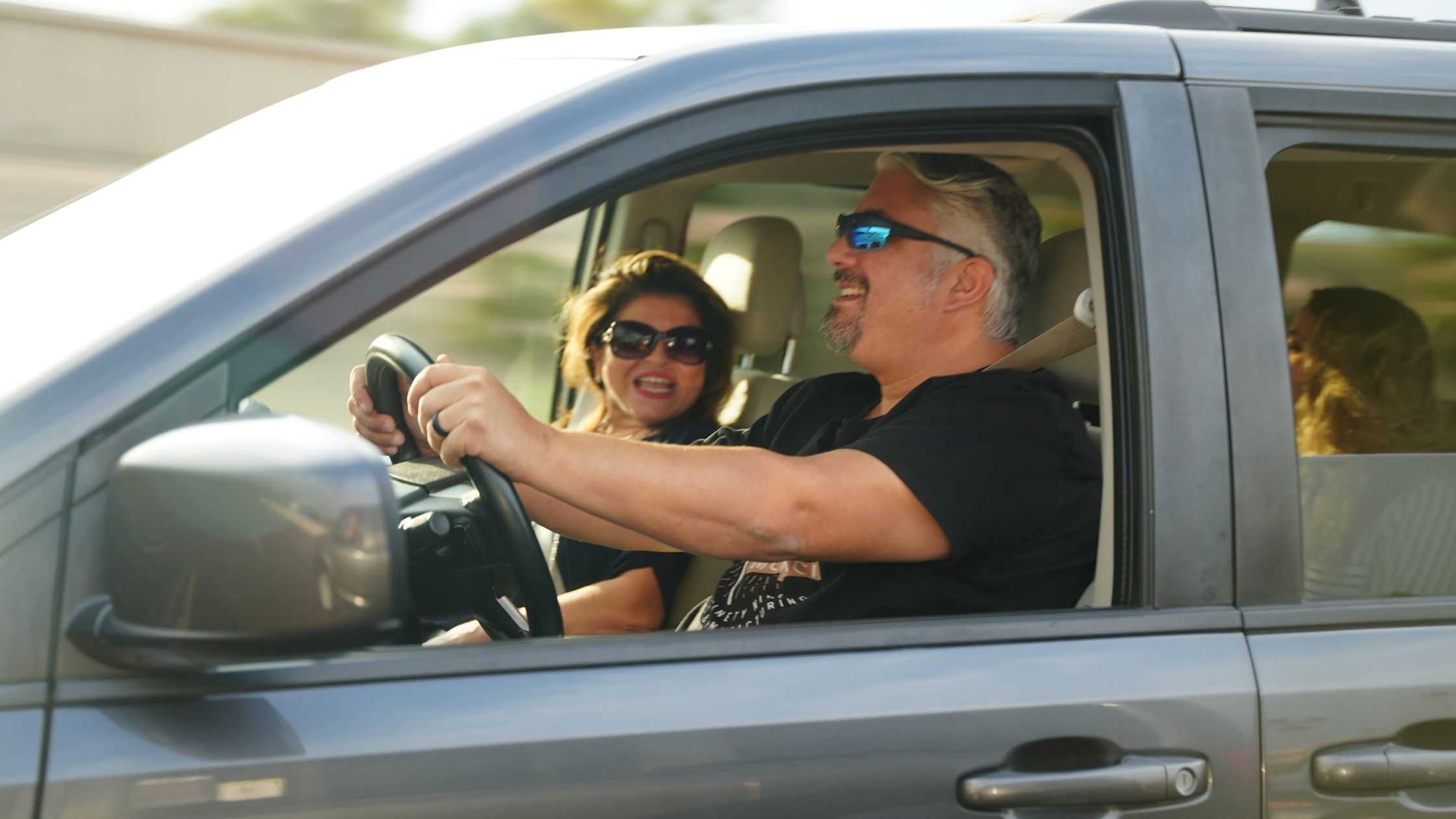 Couple enjoying summer travel in an accessible vehicle