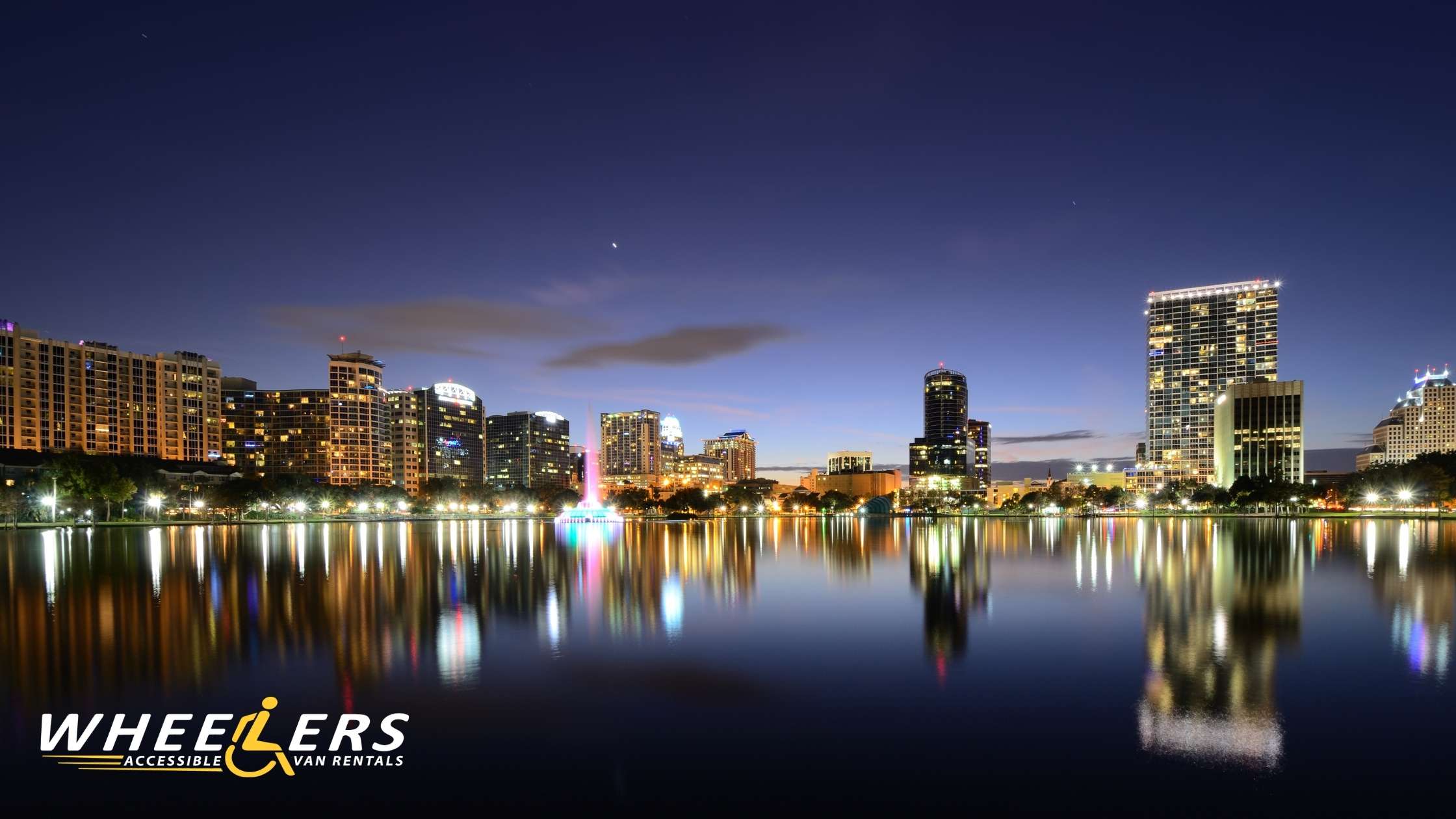 Orlando skyline at Lake Eola during evening for wheelchair accessible travel destination