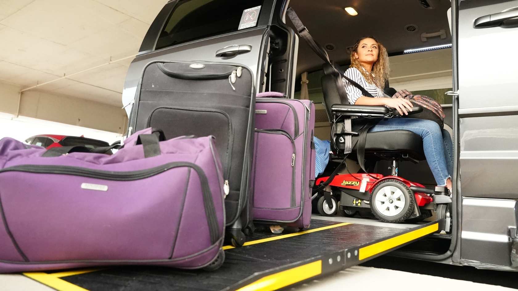 wheelchair user entering accessible van with luggage ramp travel preparation