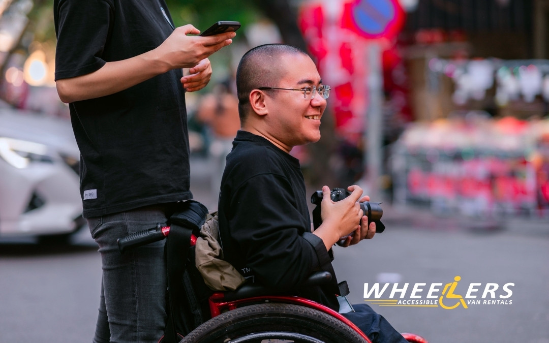 Man in Wheelchair Taking Photos