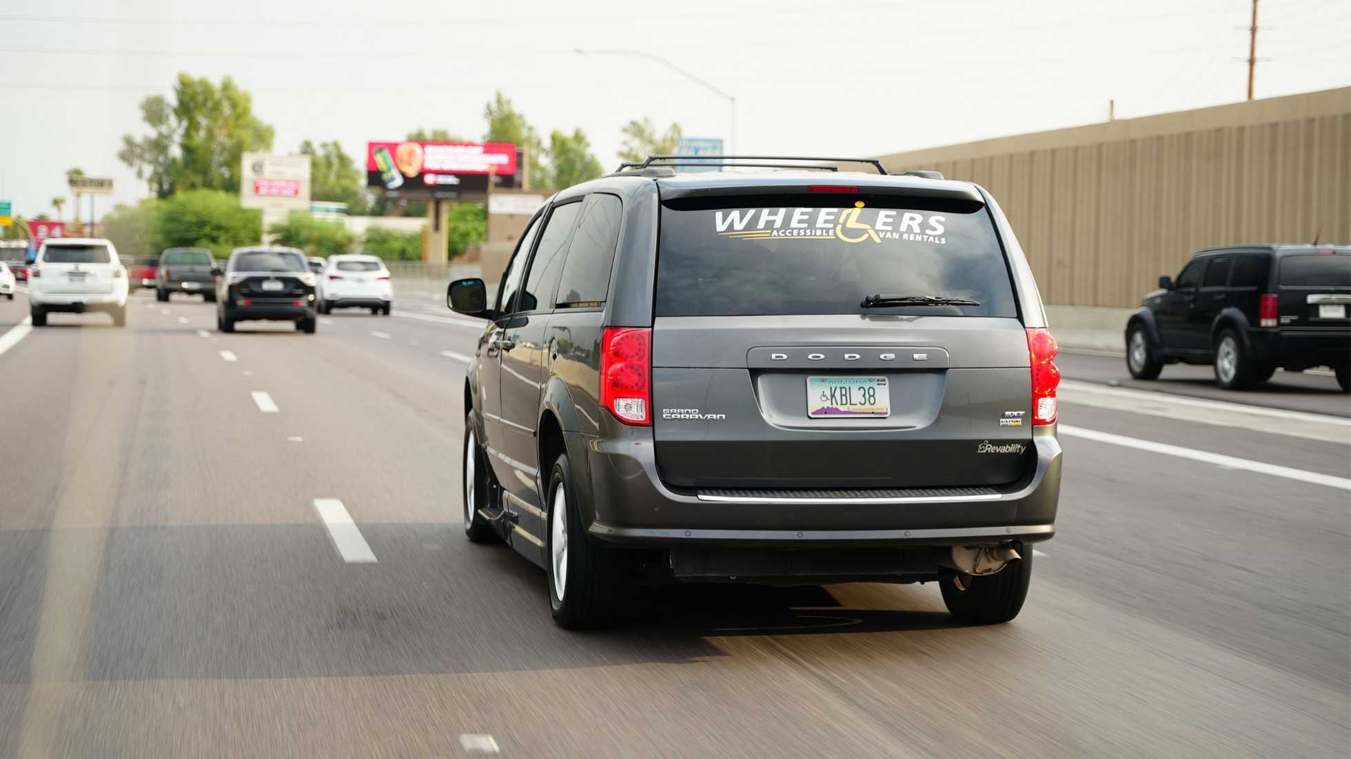 wheelchair accessible van driving on highway for road trip travel