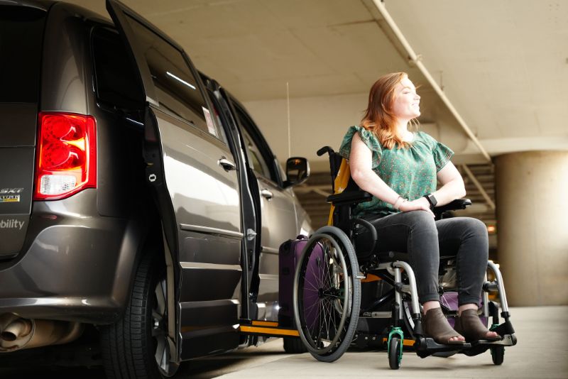 Woman in Wheelchair Getting Out of Van