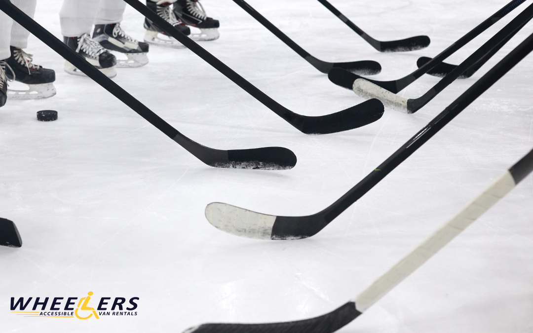 Close-up of hockey sticks and players on the ice rink at a game in Tampa’s Amalie Arena, home of the Tampa Bay Lightning.
