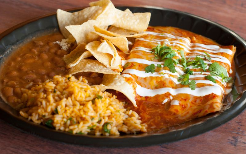 Plate of Mexican Food with Rice, Beans, and Enchiladas