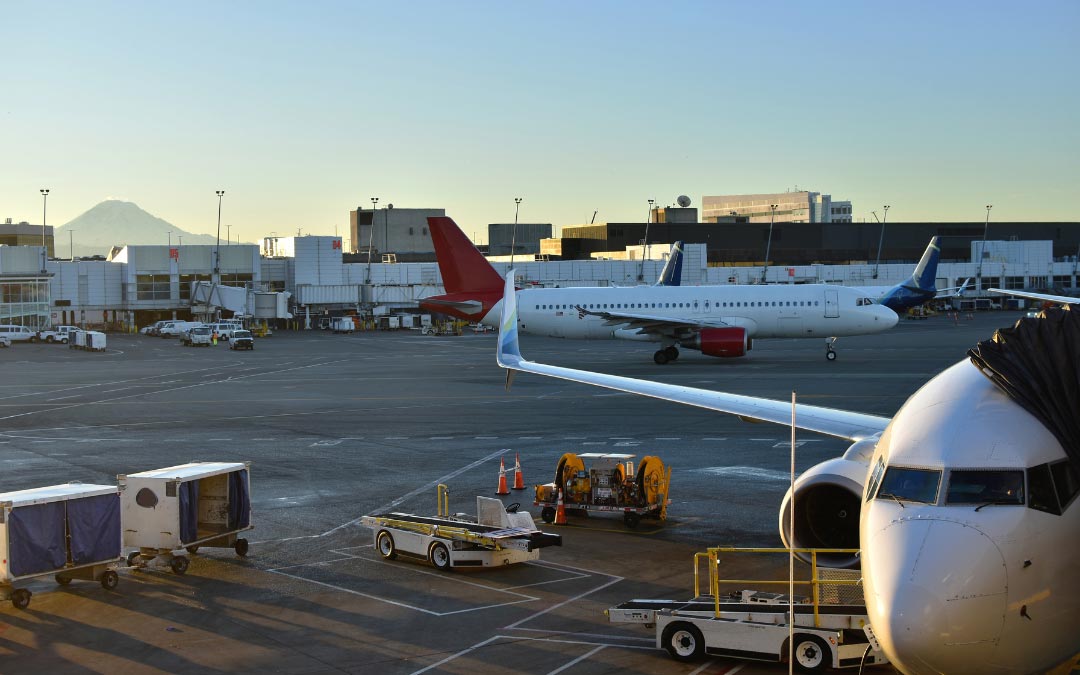 Airplanes on the tarmac at Seattle airport terminal